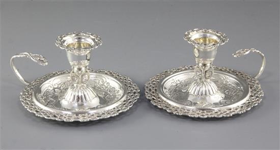 A nice pair of Victorian silver pierced chamber sticks, Diameter 4 ½”/115mm Height 2 ½”/64mm, Total weight 8.1oz/230 grms